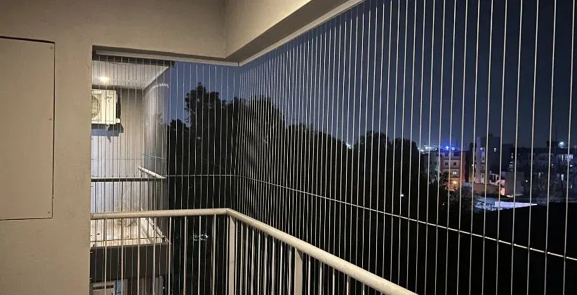 Invisible grill installed on a modern balcony